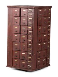 A Rotating Hardware Store Storage Cabinet in Red Paint