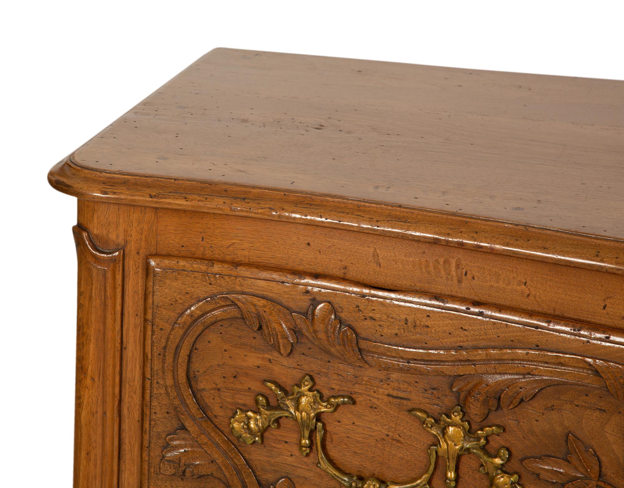 A French Provincial Carved Oak Commode