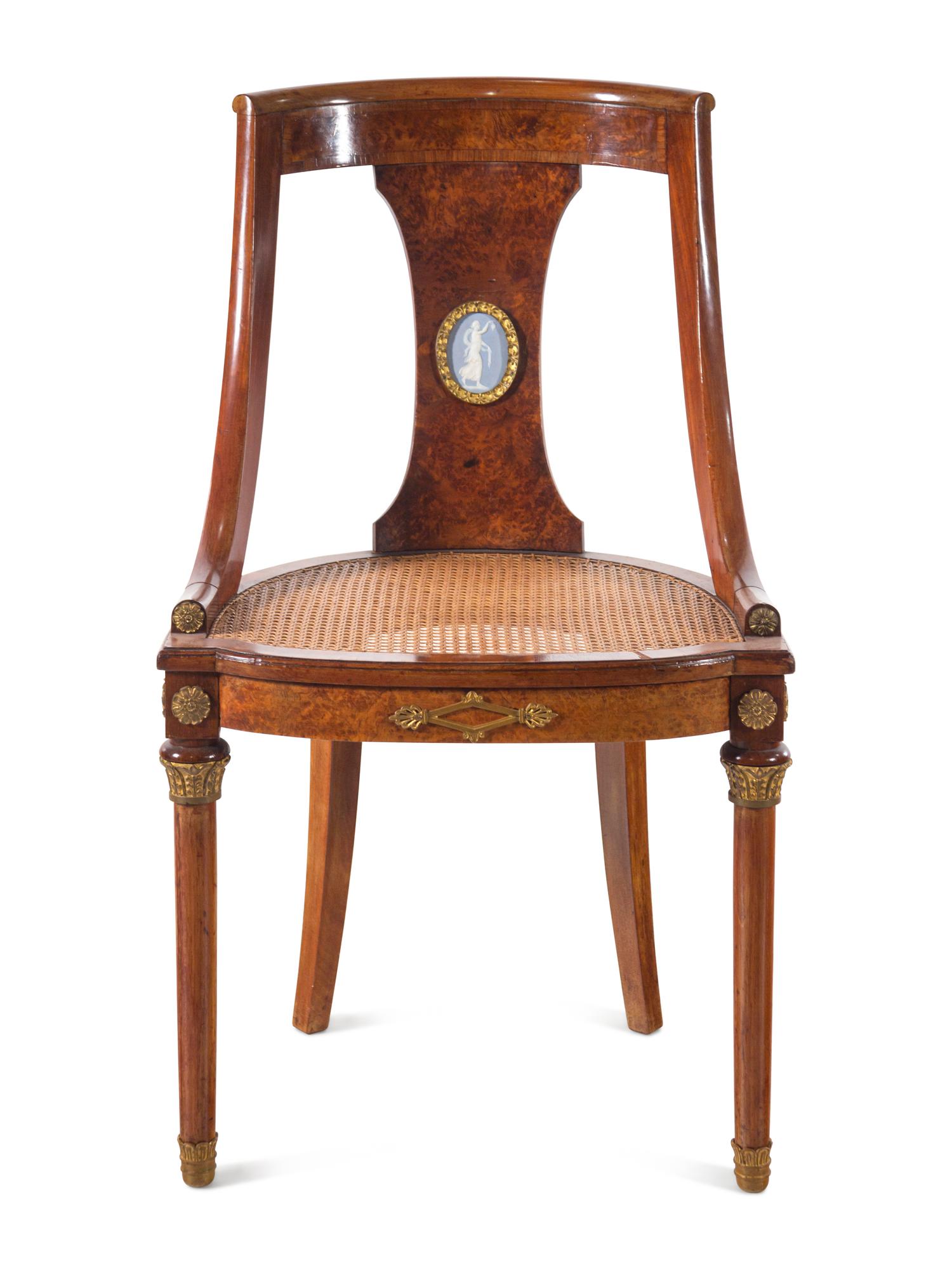 A French Gilt Bronze and Jasperware Mounted Burlwood Dining Suite