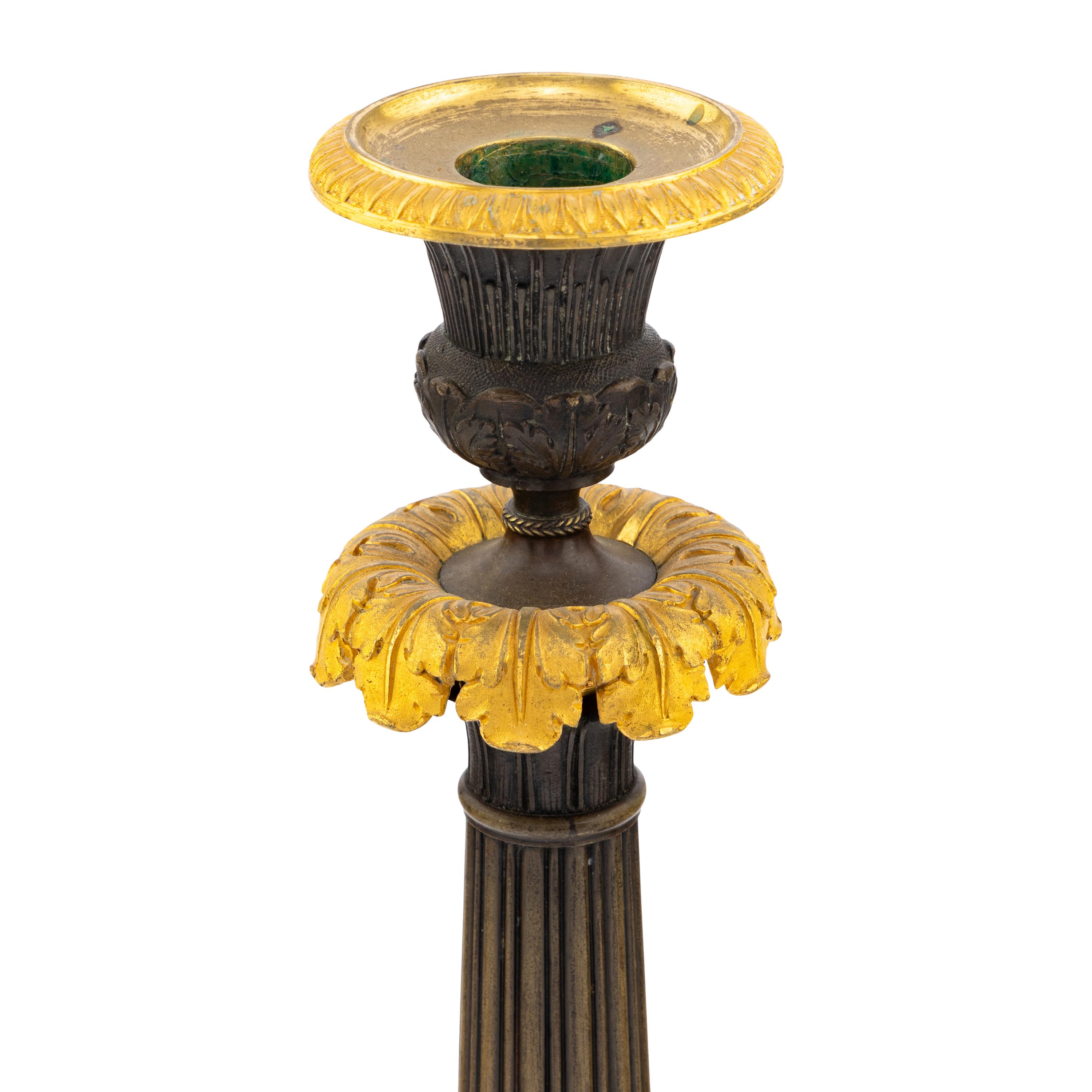 A Pair of Charles X Gilt and Patinated Bronze Candlesticks