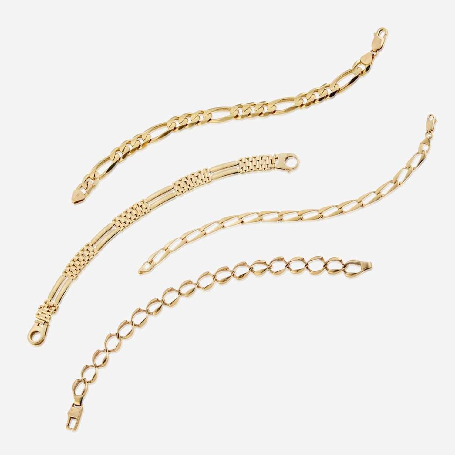 A collection of four fourteen karat gold bracelets