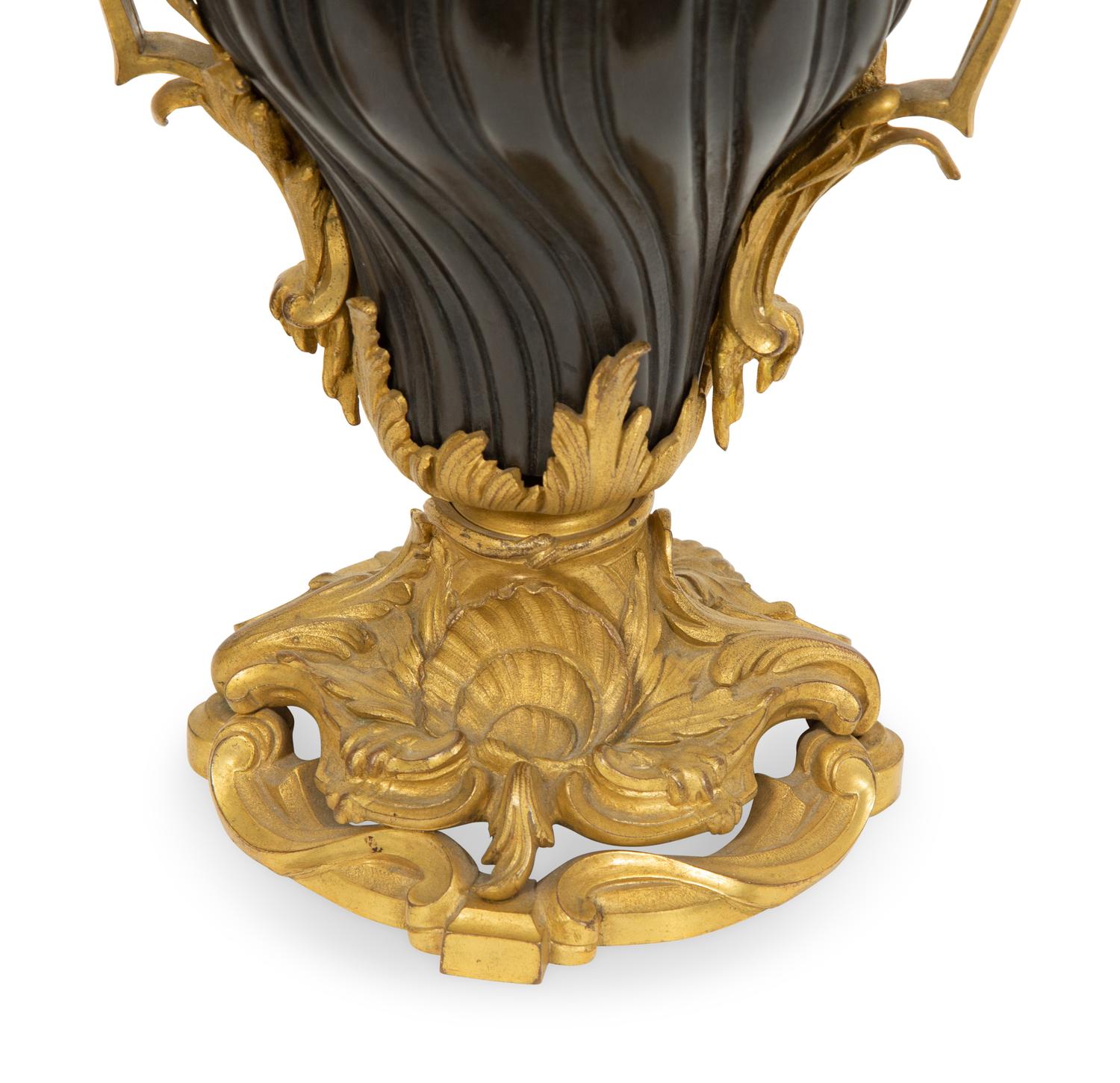 A Pair of French Gilt and Patinated Bronze Urns