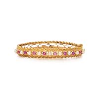PINK SAPPHIRE, SEED PEARL, AND YELLOW GOLD BANGLE BRACELET