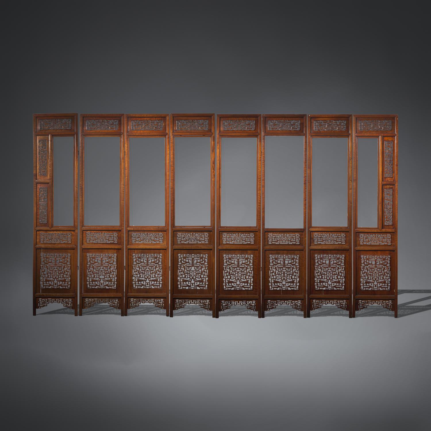 A Large Chinese Carved Hardwood, Possibly Longyan Mu, and Glass Eight-Panel Screen 或為龍眼木嵌玻璃透雕夔龍紋八扇屏