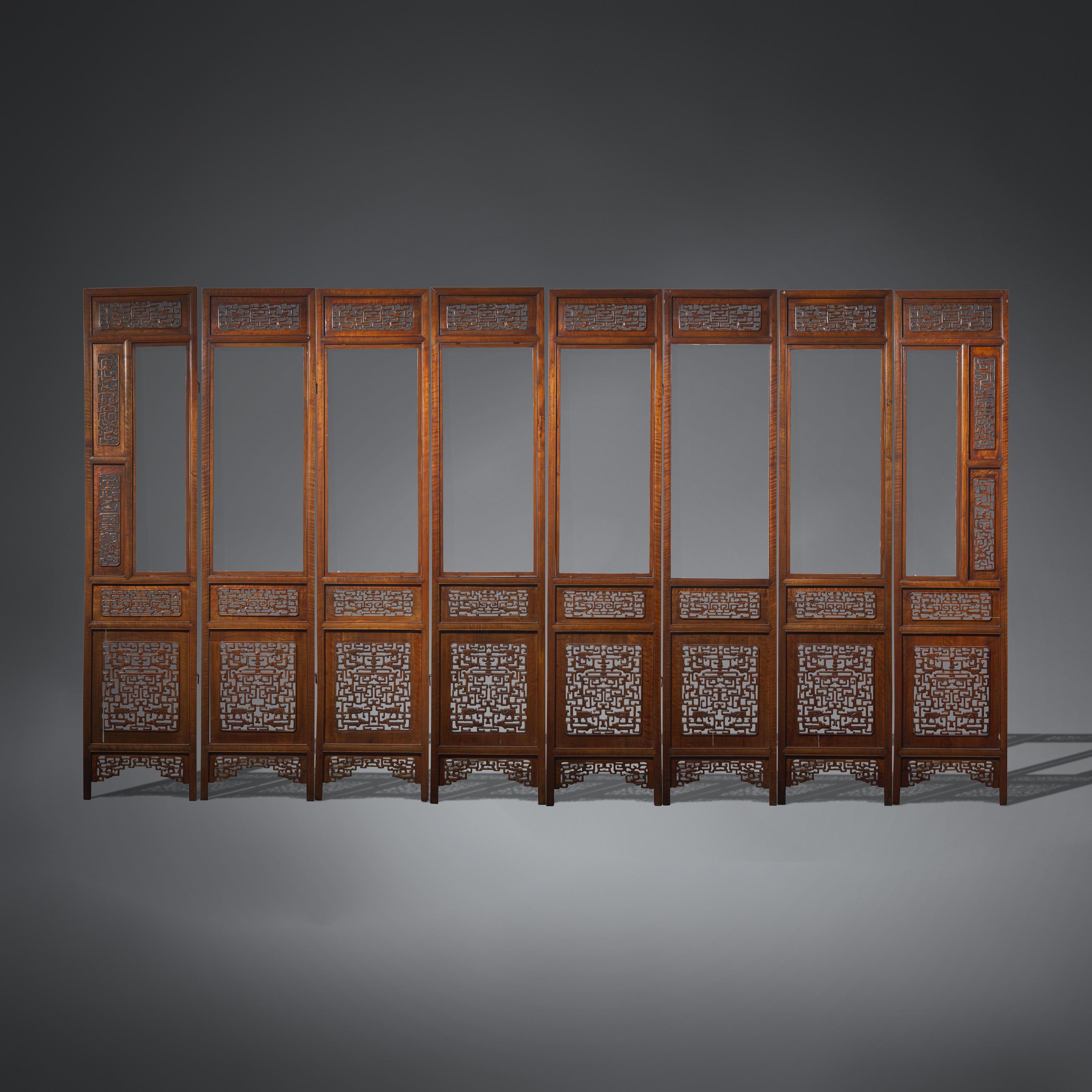 A Large Chinese Carved Hardwood, Possibly Longyan Mu, and Glass Eight-Panel Screen 或為龍眼木嵌玻璃透雕夔龍紋八扇屏