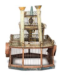 A Folk Art Cut and Painted Metal Paddleboat Form Birdcage