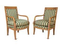 A Set of Twelve Directoire Style Carved Light Wood Dining Chairs — 20TH CENTURY