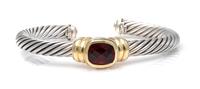 A Sterling Silver, 14 Karat Yellow Gold and Garnet 'Noblesse' Cuff Bracelet, David Yurman, 36.70 dwts.