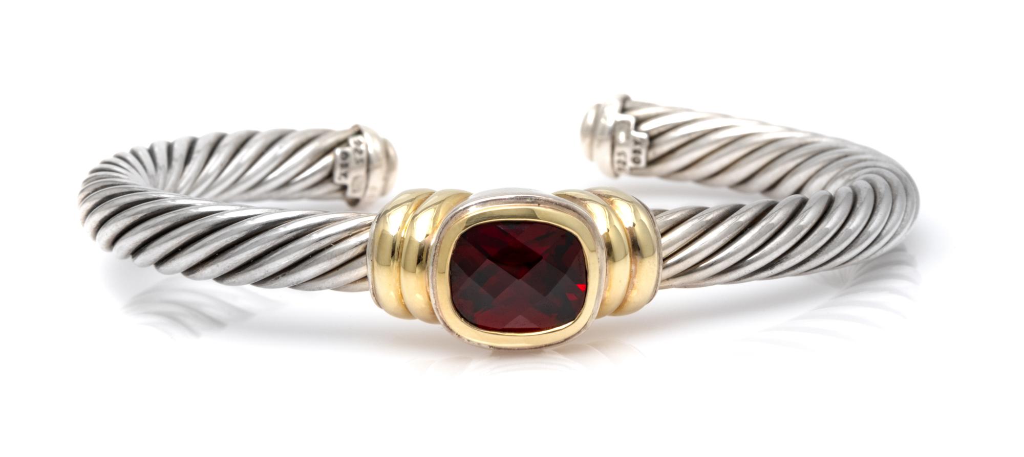 A Sterling Silver, 14 Karat Yellow Gold and Garnet 'Noblesse' Cuff Bracelet, David Yurman, 36.70 dwts.