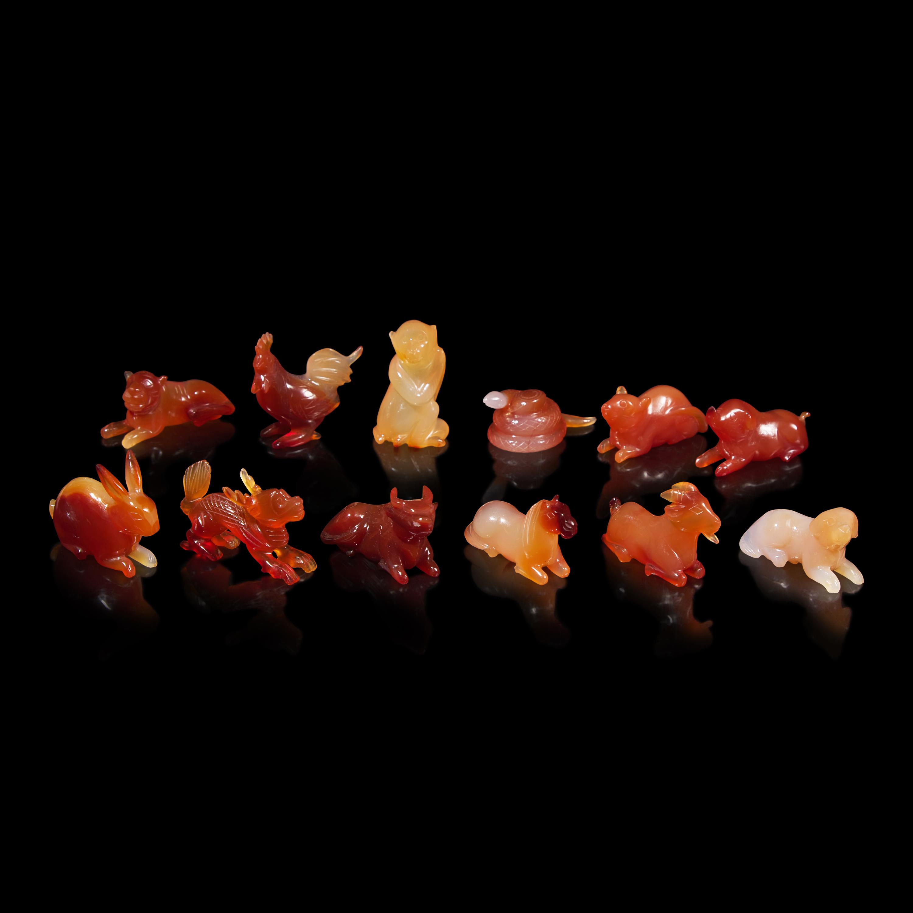 A Set of 12 Chinese Carved Agate Zodiac Figures, 20th Century 近代 瑪瑙雕生肖把件一組十二件