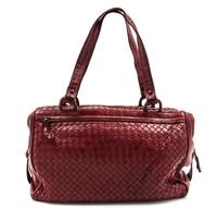 A Bottega Veneta Burgundy Intrecciato Leather Duffle Bag, 14 x 8 x 6 inches.