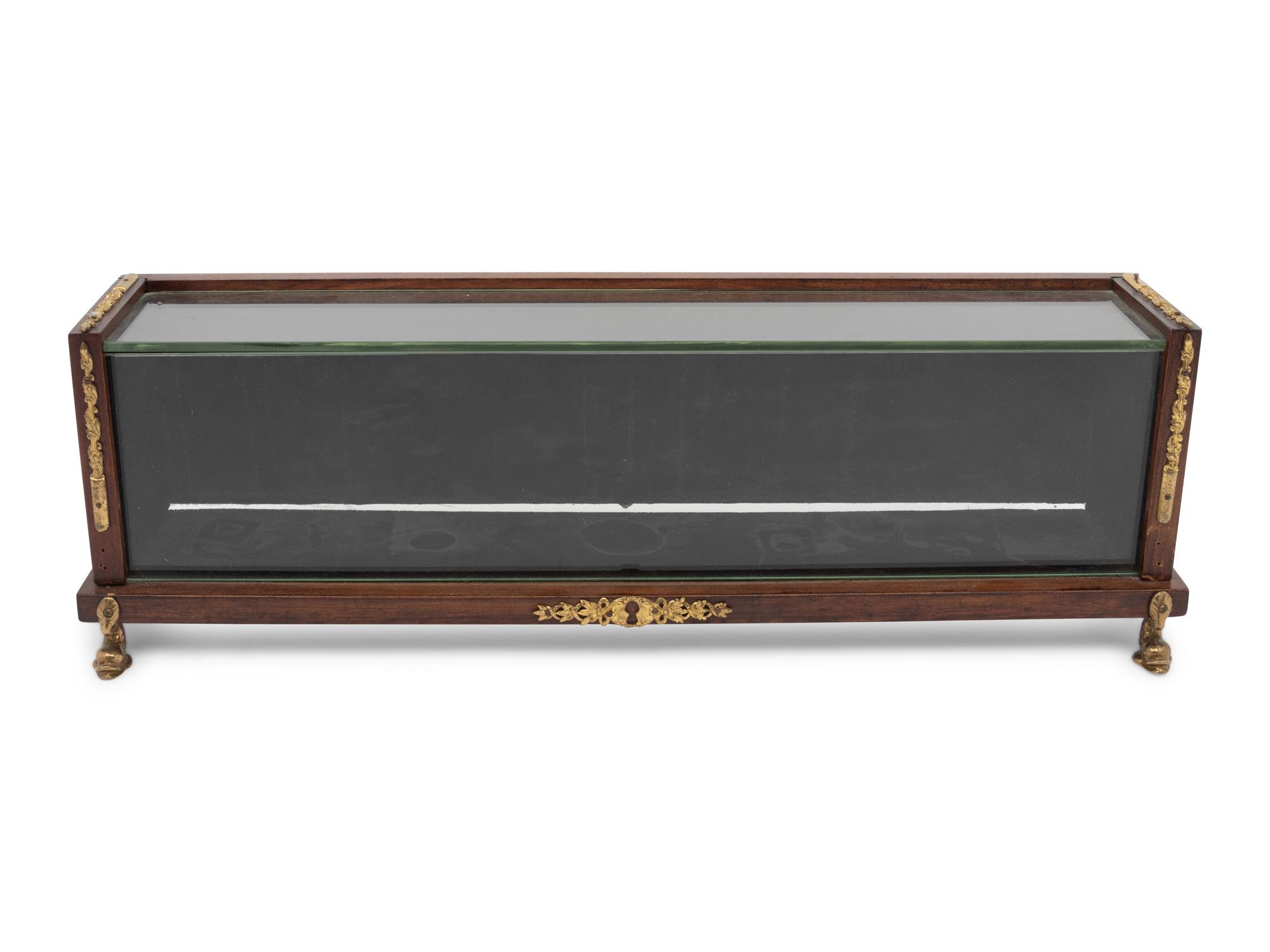 A Continental Gilt Metal Mounted Mahogany Vitrine Case