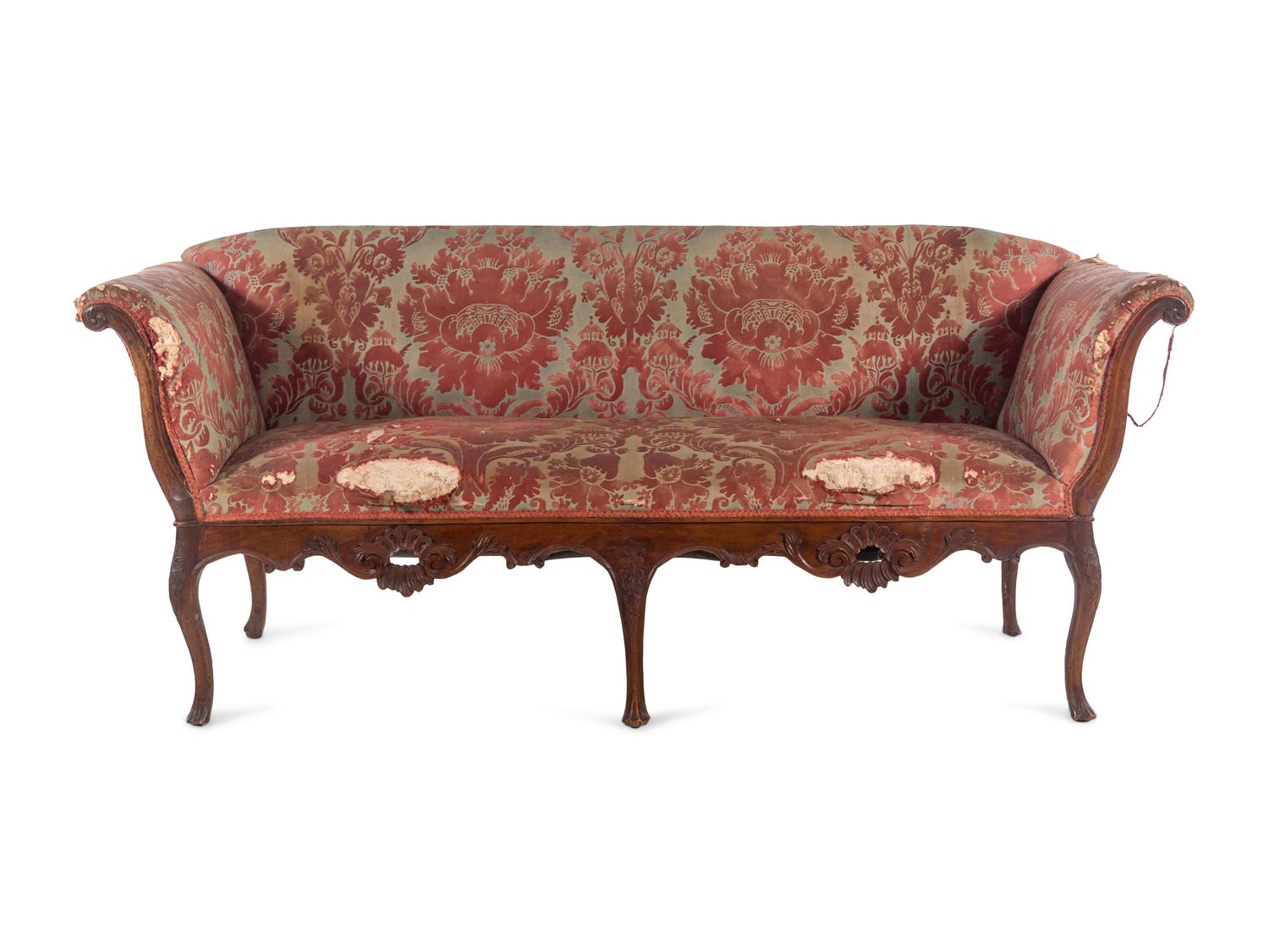 An Italian Carved Walnut Sofa