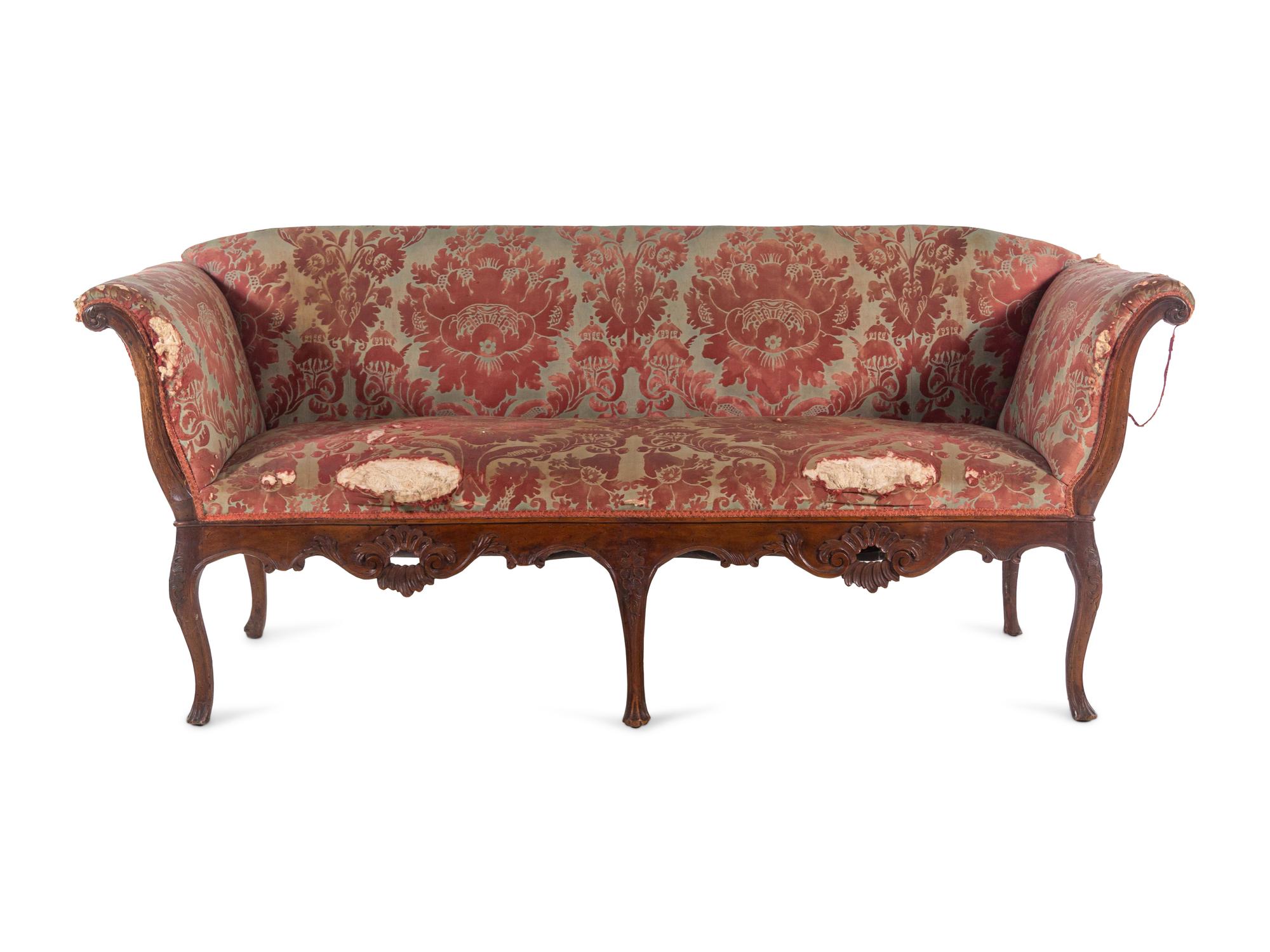 An Italian Carved Walnut Sofa