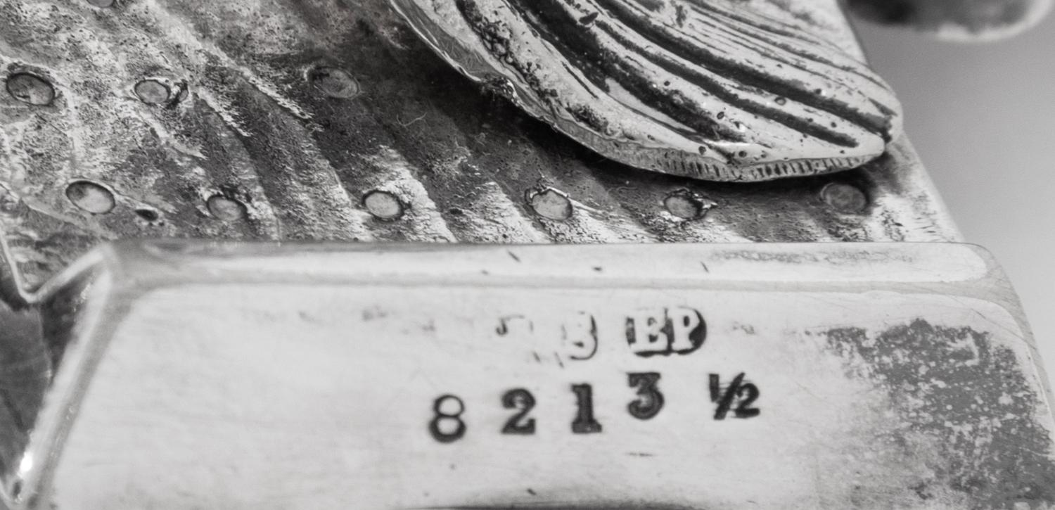A Group of Eight Curling Stone-Form Silver-Plate Table Articles