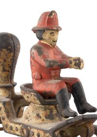 A Cast Iron Fire Engine Three-Horse Train and a Horse Pull Toy