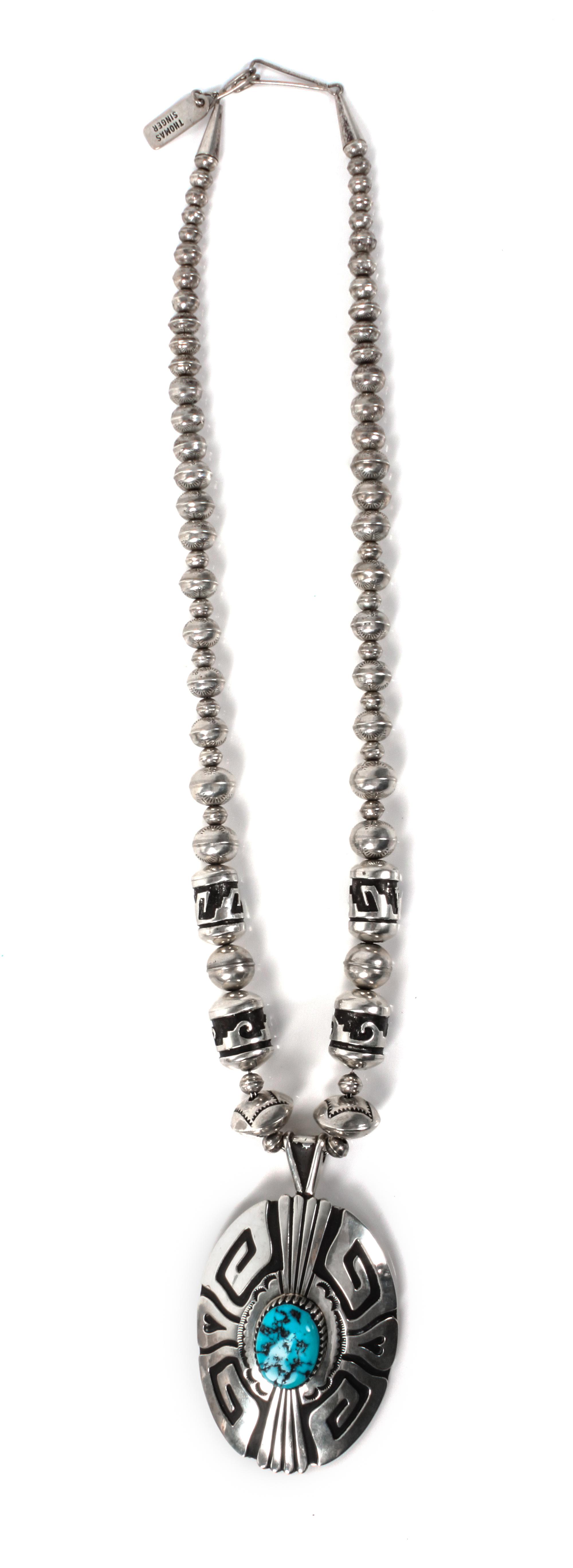 A Navajo Silver and Turquoise Pendant and Bead Necklace, Tommy Singer Length 12 inches; height of pendant 3 1/4 x width 2 inches.