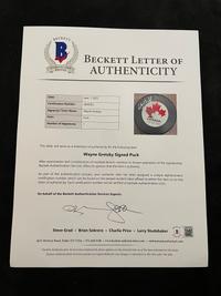 A Wayne Gretzky Signed Autograph Canada Hockey Puck (Beckett Authentication Services Letter BAS Certified),