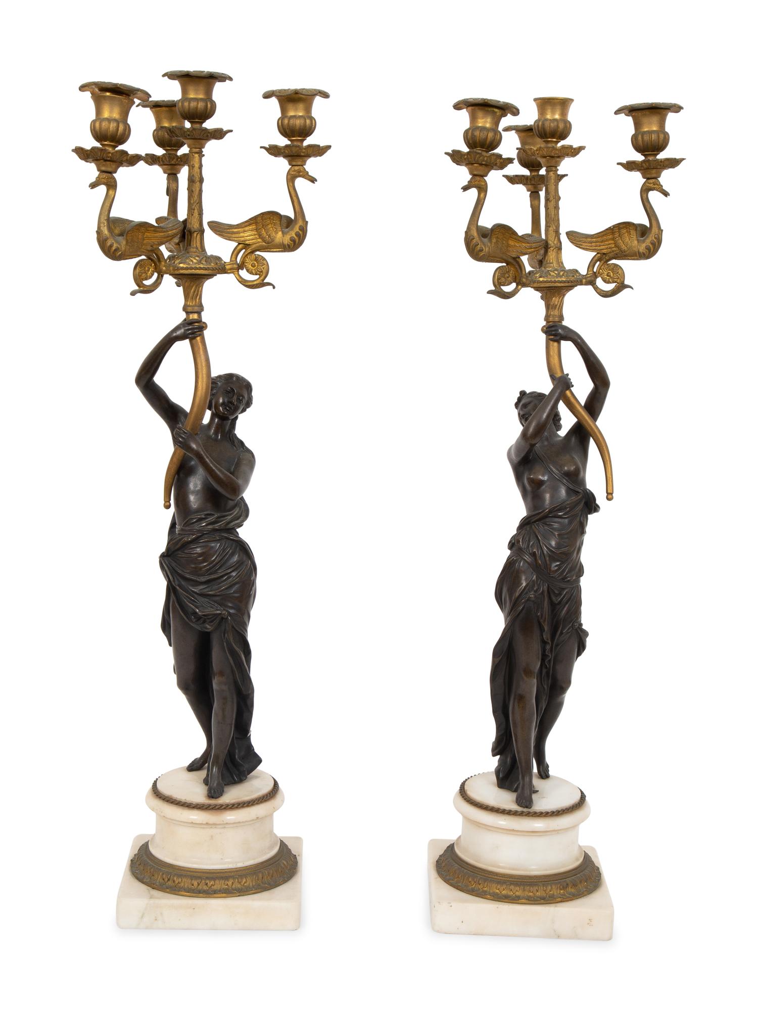 A Pair of French Empire Style Gilt and Patinated Bronze Figural Four-Light Candelabra