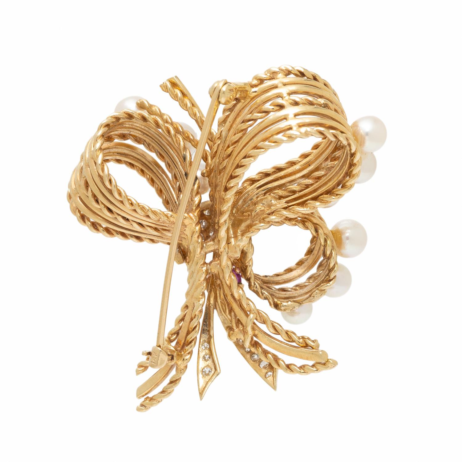 YELLOW GOLD, DIAMOND, RUBY, AND CULTURED PEARL BOW BROOCH