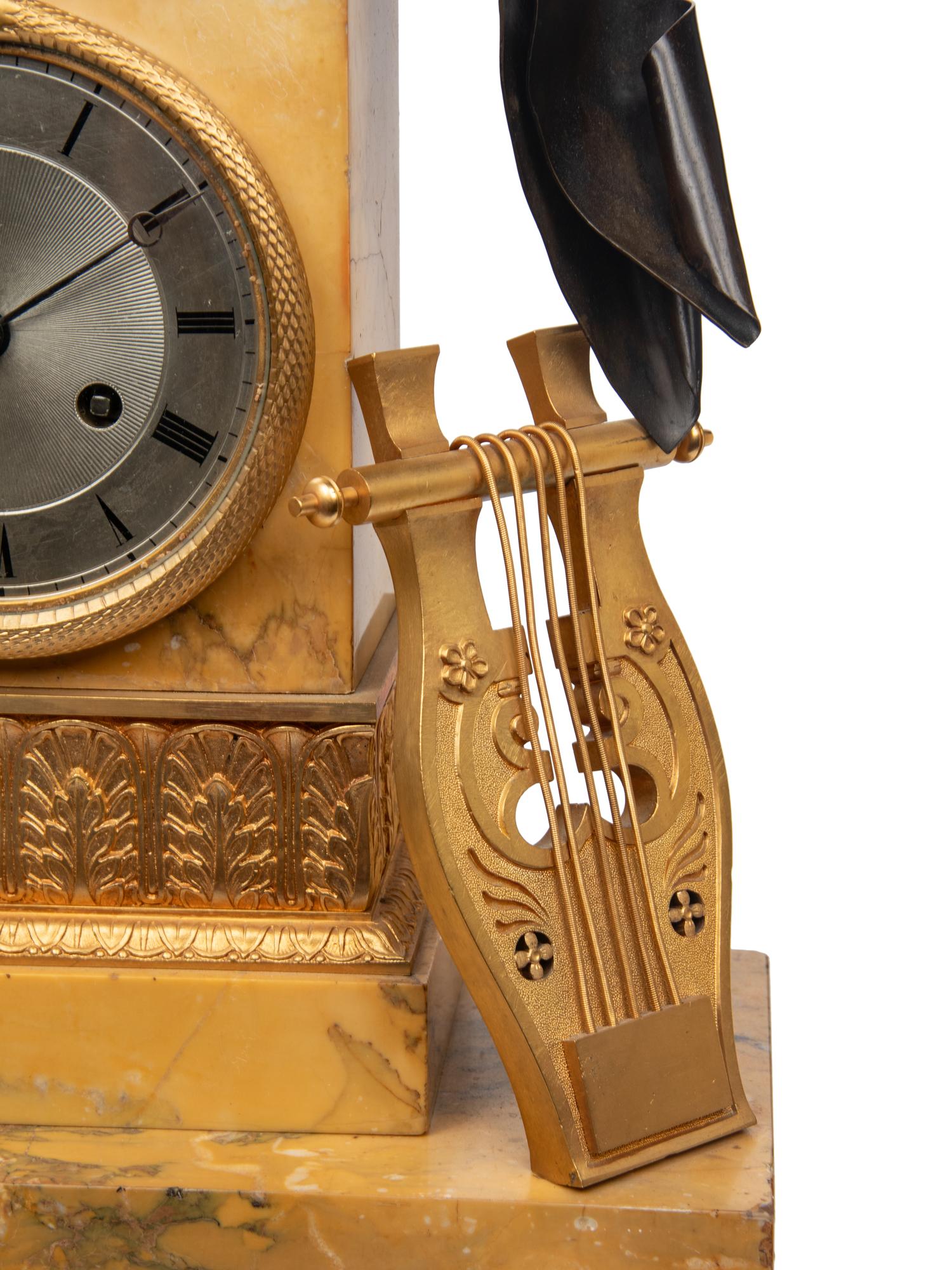 A Large Empire Gilt and Patinated Bronze and Marble Figural Clock