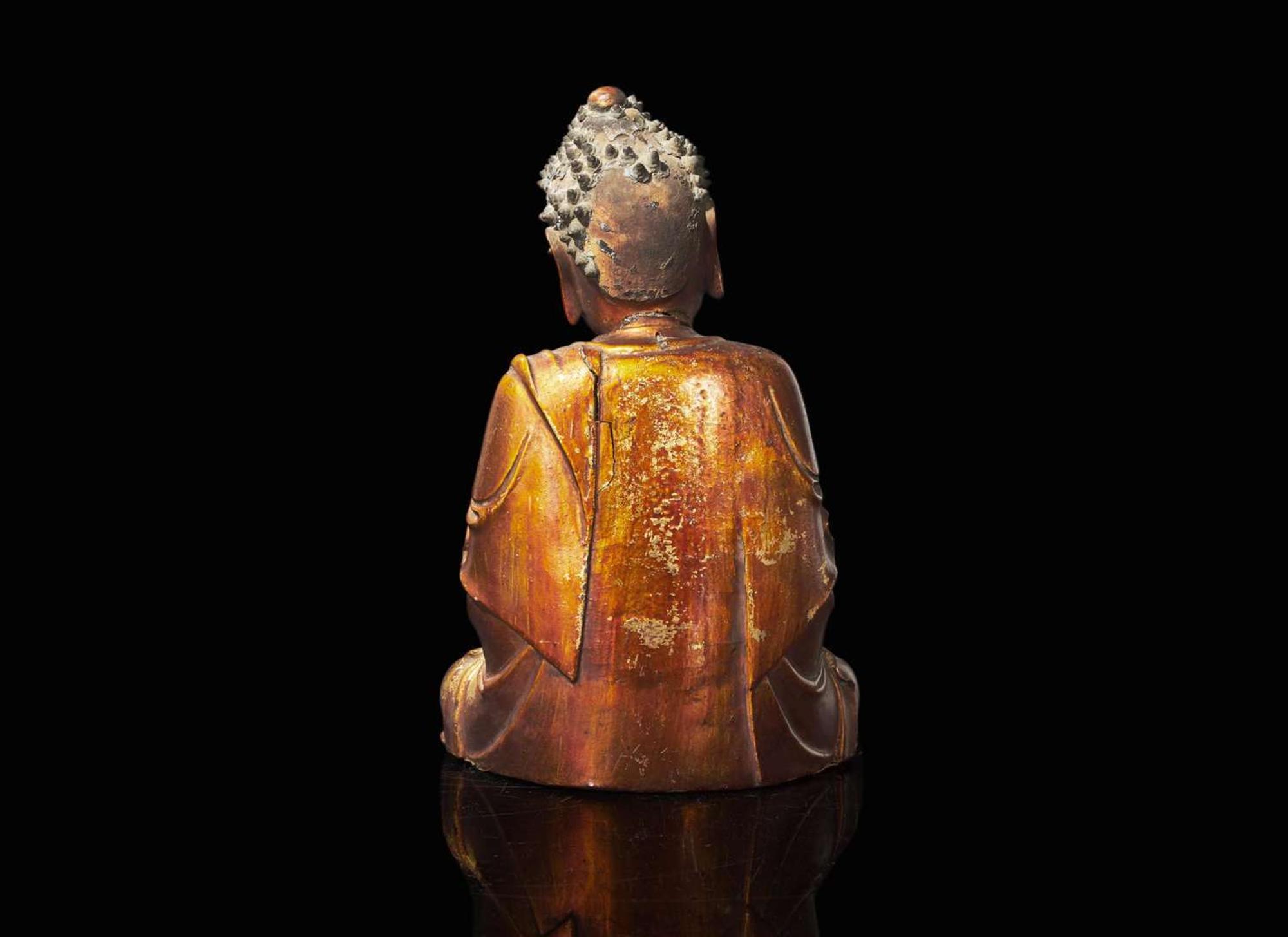 A Chinese gilt lacquered figure of Buddha, Ming to Qing dynasty 木漆金佛造像一座 明或清