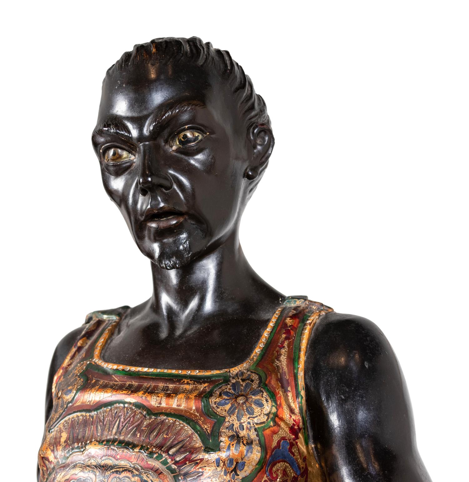 A Venetian Parcel-Gilt and Ebonized Attendant