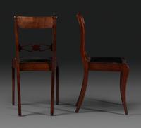 A Pair of Classical Figured and Carved Mahogany Klismos Side Chairs