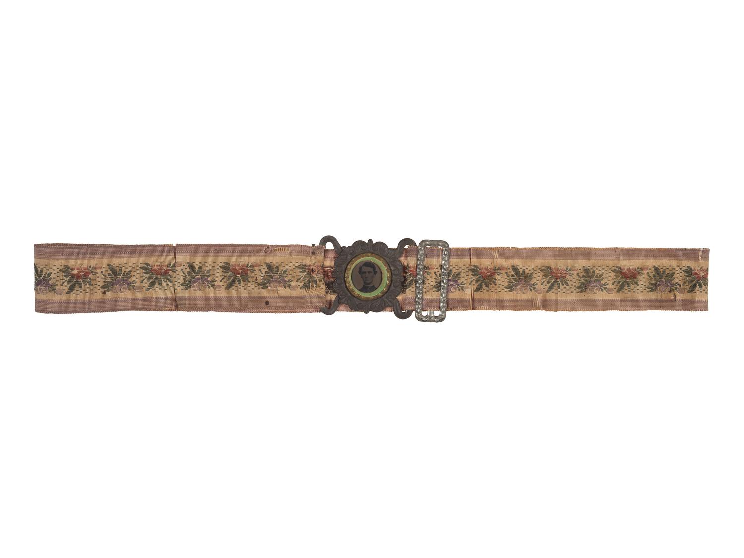 [CIVIL WAR]. Woman's woven belt with buckle containing gem-size tintype of a Civil War soldier.