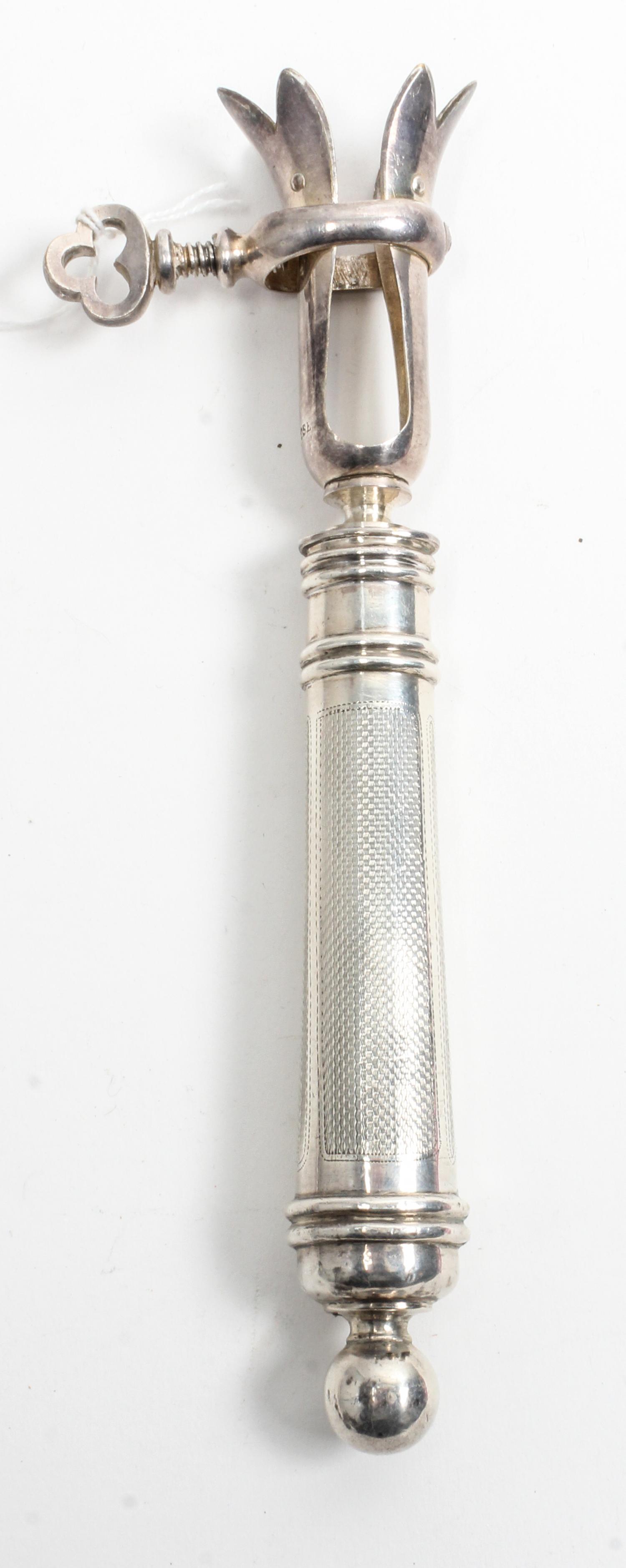 A French Silver Bone Holder, , the silver handle having engine turned decoration surrounding an engraved cartouche and having a knopped