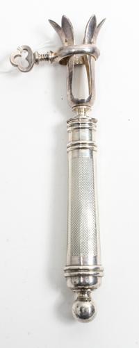A French Silver Bone Holder, , the silver handle having engine turned decoration surrounding an engraved cartouche and having a knopped