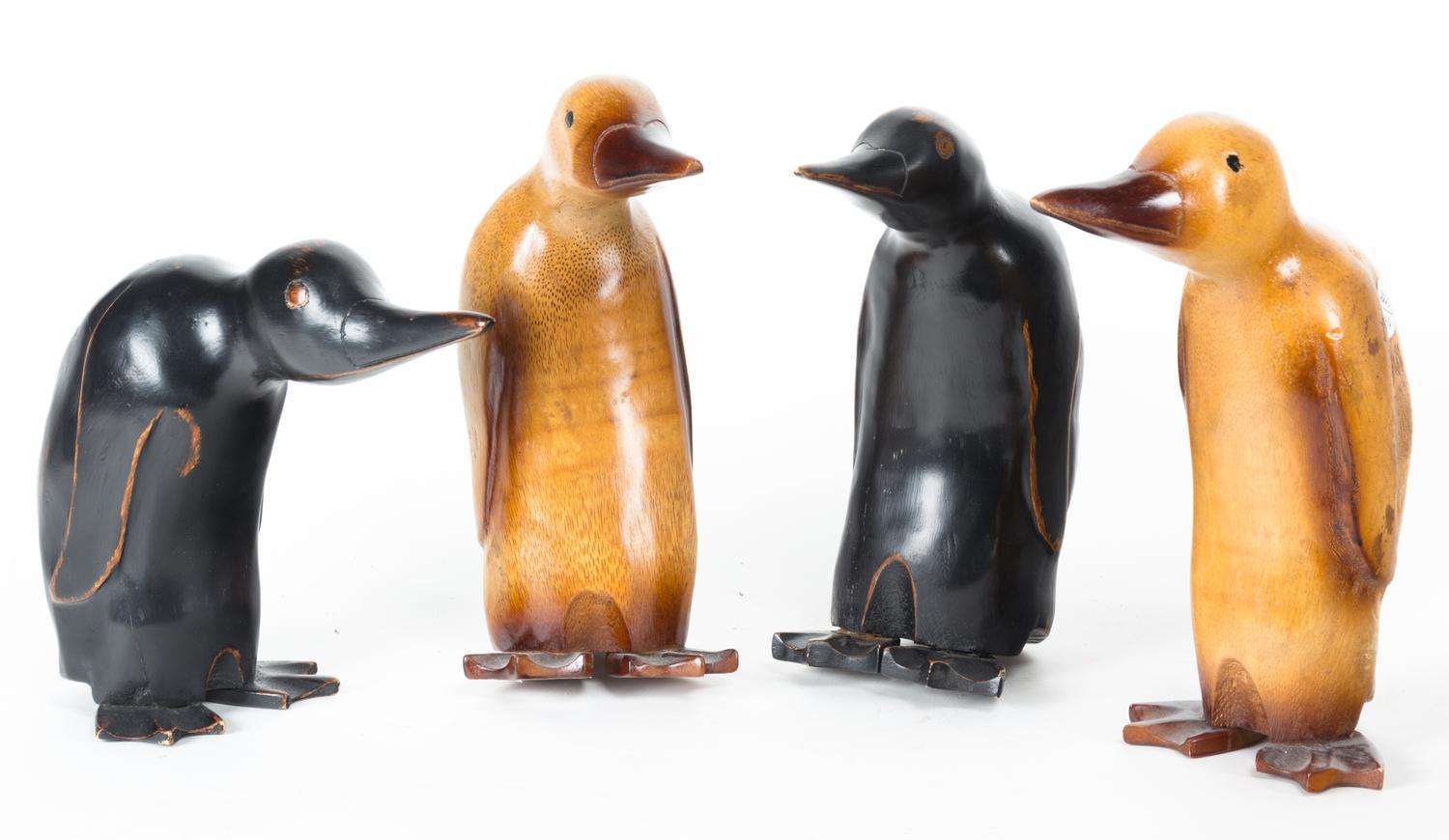Four Wooden Carved Models of Penguins Height of tallest 11 inches.