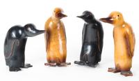 Four Wooden Carved Models of Penguins Height of tallest 11 inches.