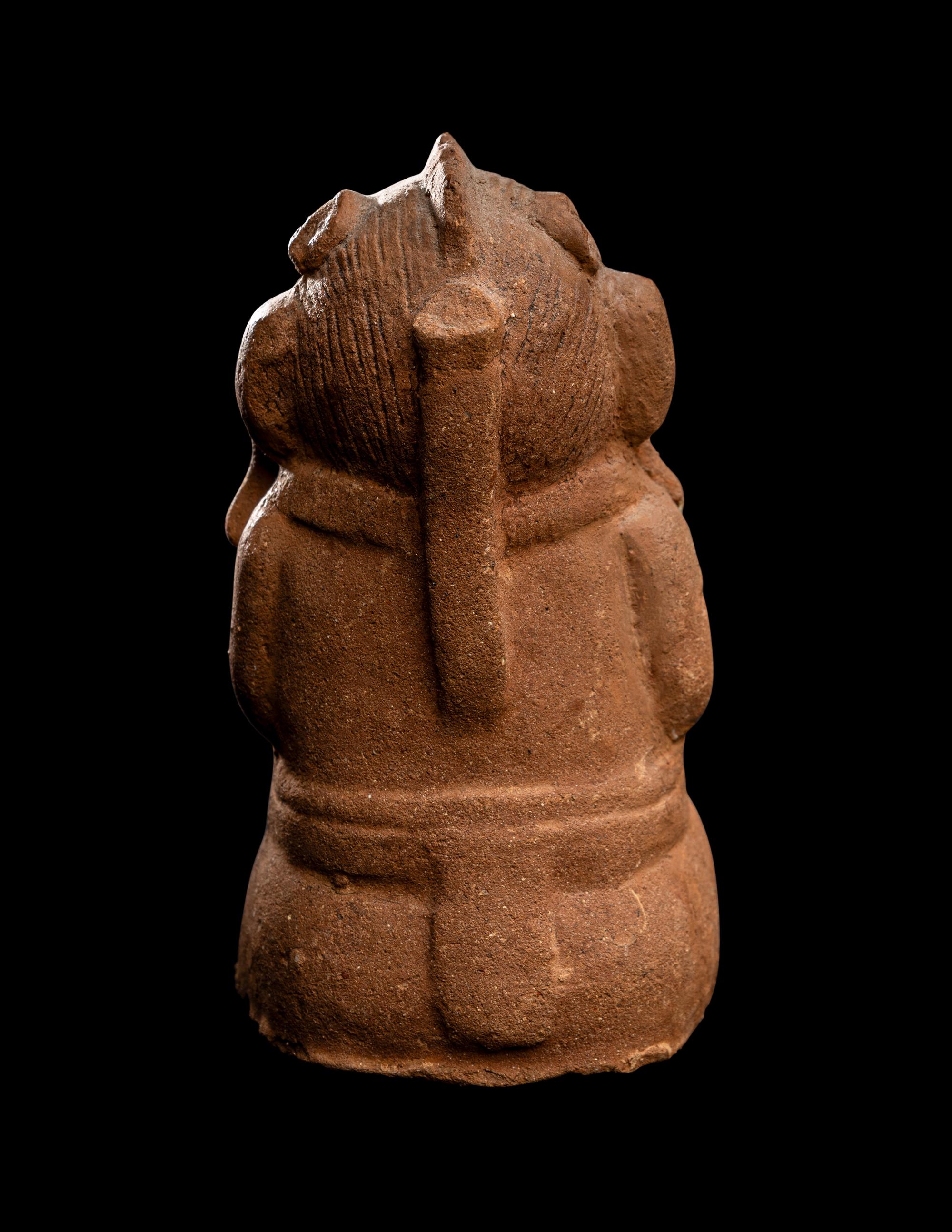 A Maya Figurine of a Seated Monkey