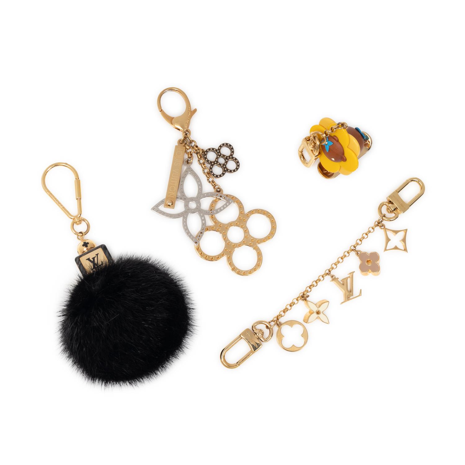 LOUIS VUITTON, GROUP OF FOUR BAG CHARMS