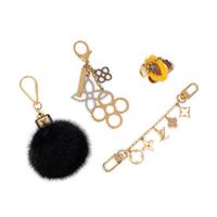LOUIS VUITTON, GROUP OF FOUR BAG CHARMS