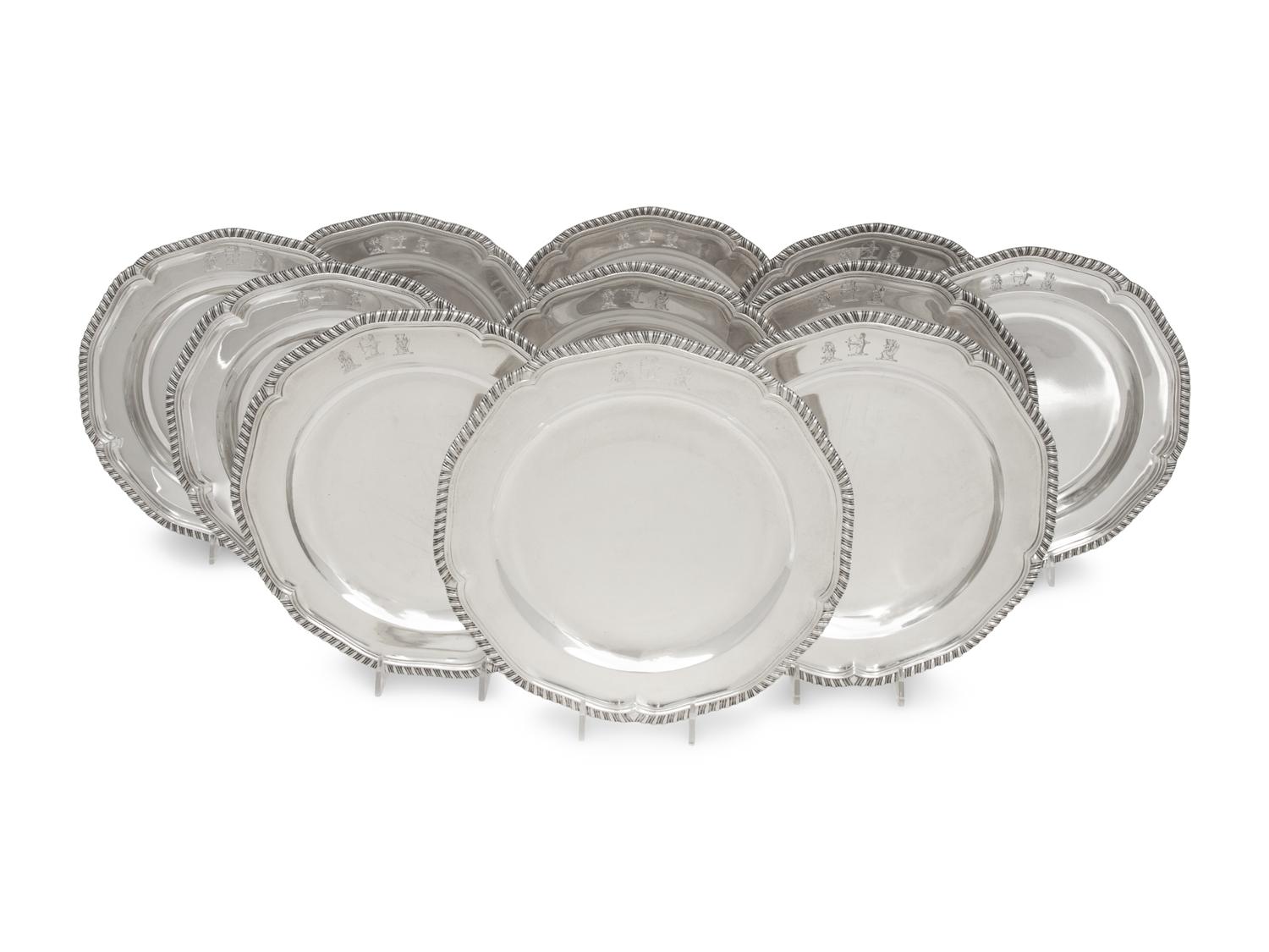 A Set of Twelve George III Silver Dinner Plates