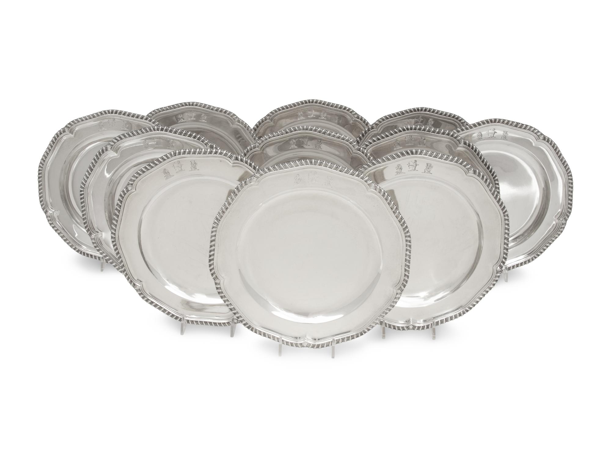 A Set of Twelve George III Silver Dinner Plates
