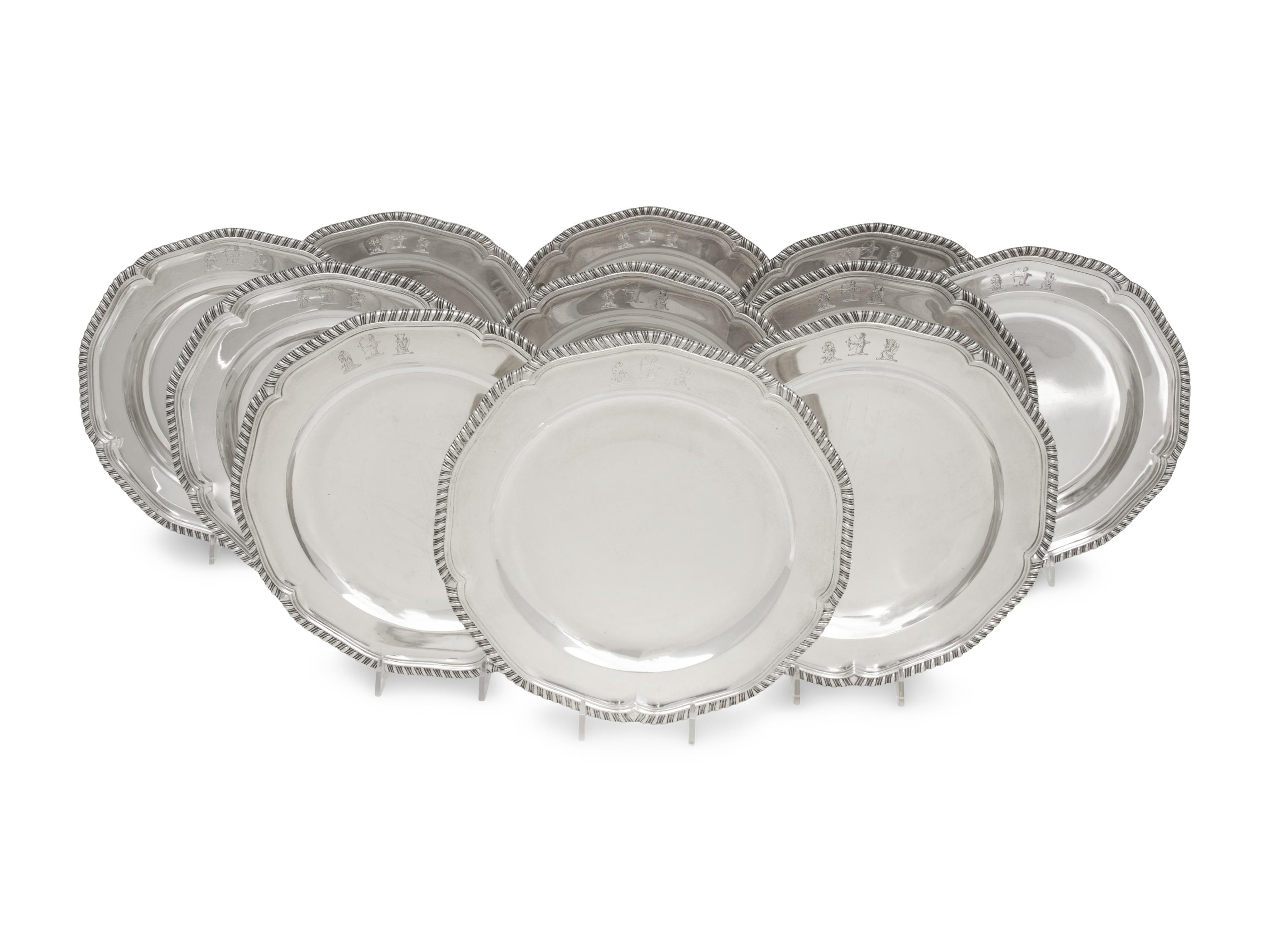 A Set of Twelve George III Silver Dinner Plates
