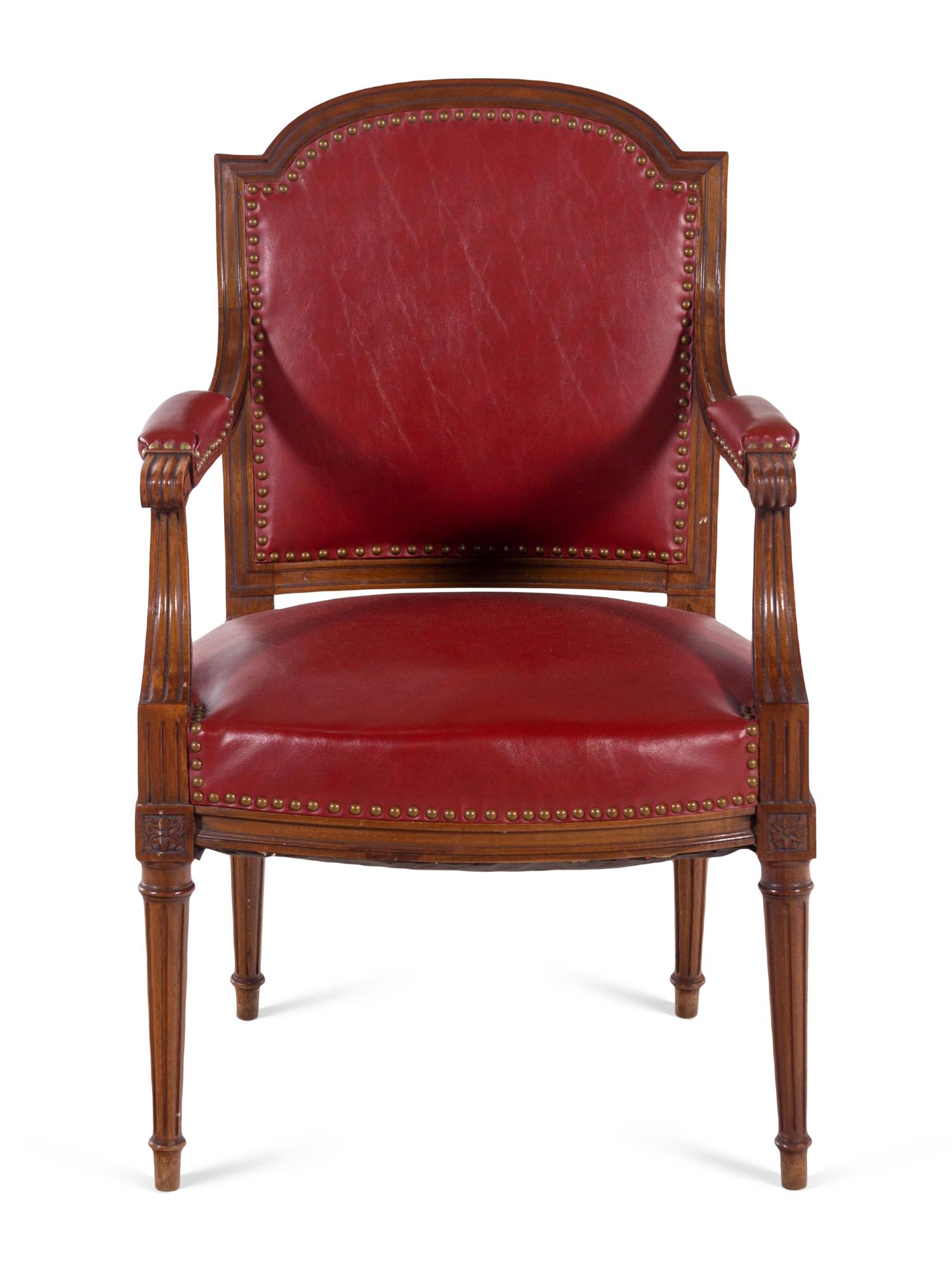 A Pair of Louis XVI Style Walnut Fauteuils