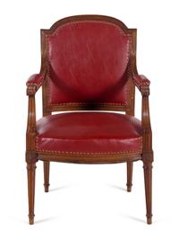 A Pair of Louis XVI Style Walnut Fauteuils