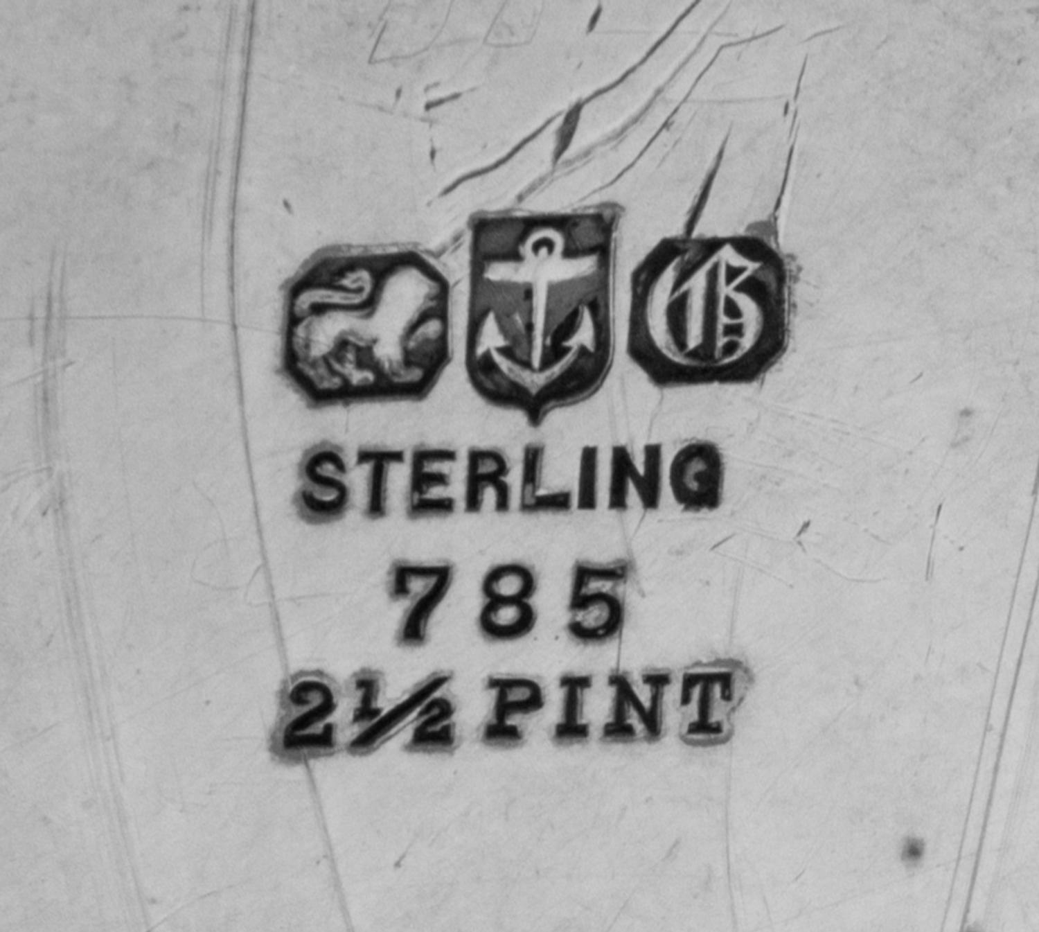 An American Silver Trophy Cup of Rowing Interest, Gorham Mfg. Co., Providence, RI, 1897, of Tyg form, the body engraved with a scene of