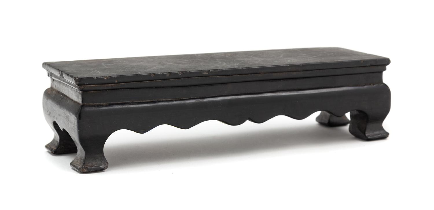 A Chinese Black Hardstone Stand Length 8 1/4 inches. — 20TH CENTURY