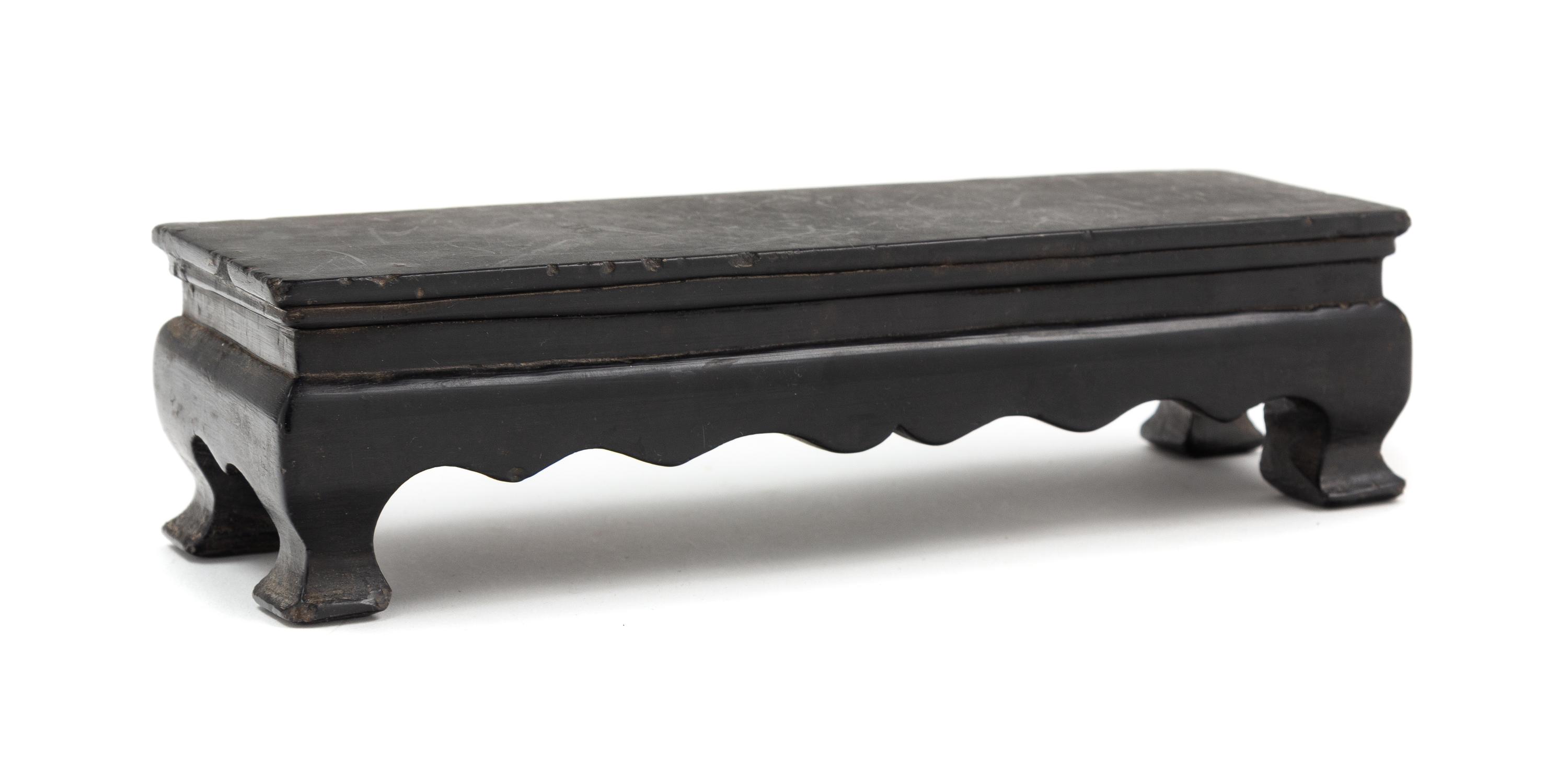 A Chinese Black Hardstone Stand Length 8 1/4 inches. — 20TH CENTURY
