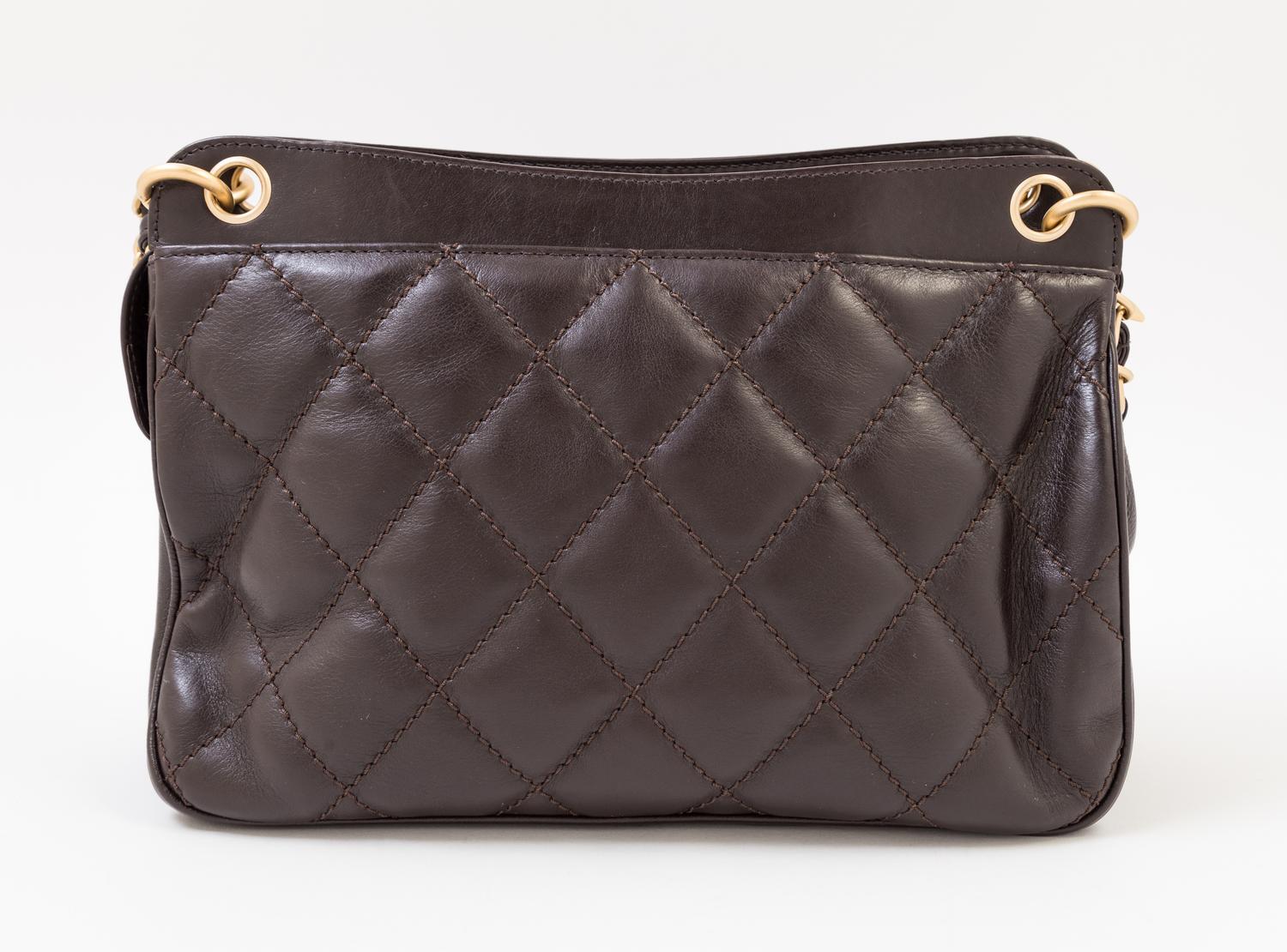 A Chanel Brown Leather Quilted Handbag, 12" x 8" x 3.5"; Strap drop: 10".