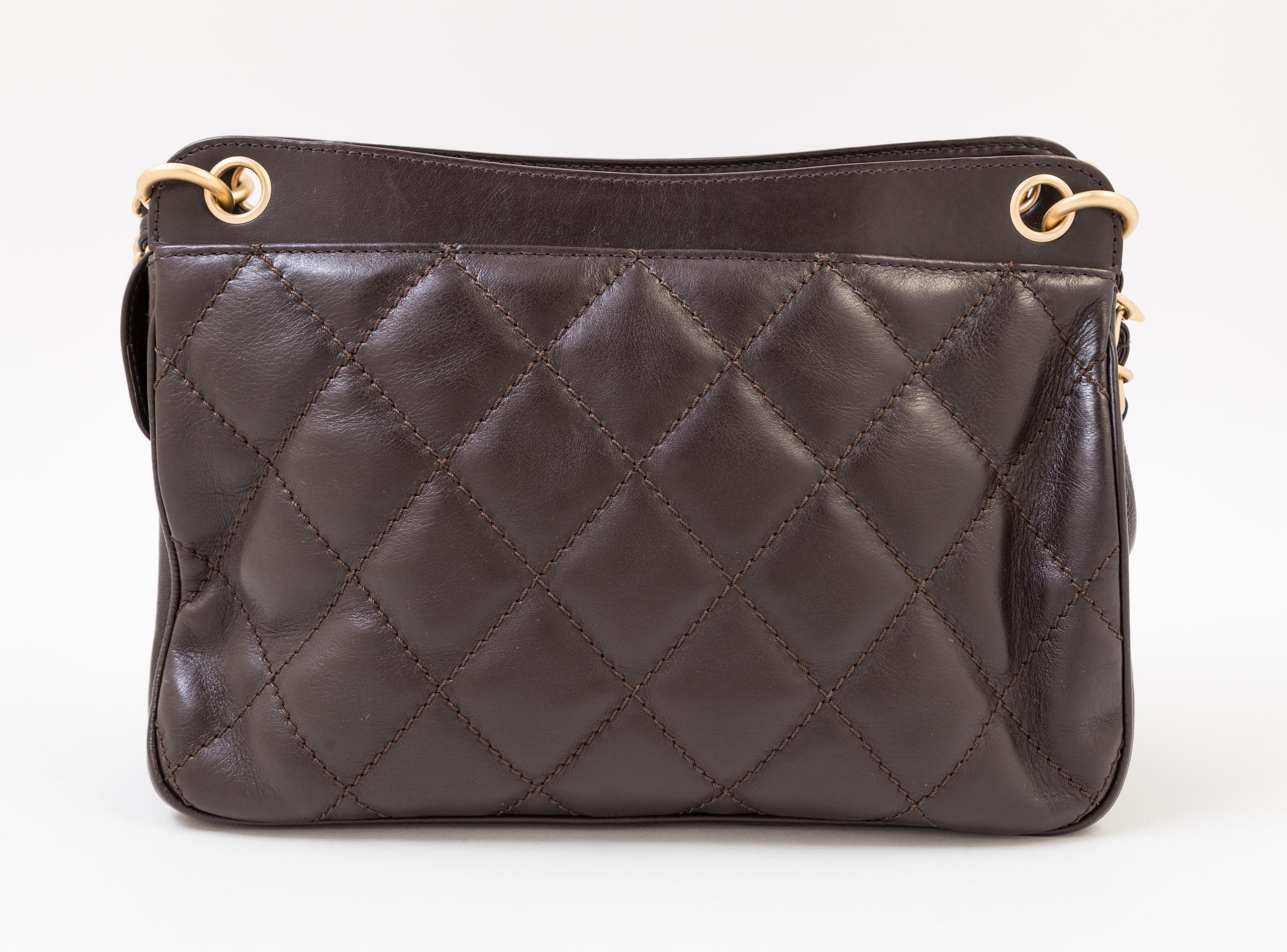 A Chanel Brown Leather Quilted Handbag, 12" x 8" x 3.5"; Strap drop: 10".