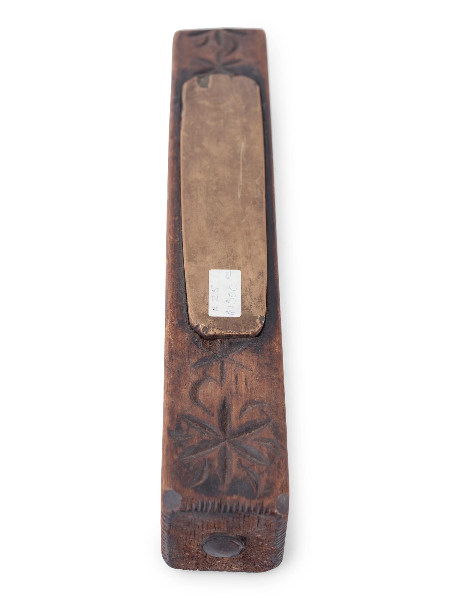 A Carved Wooden Folk Art Knife Sharpener
