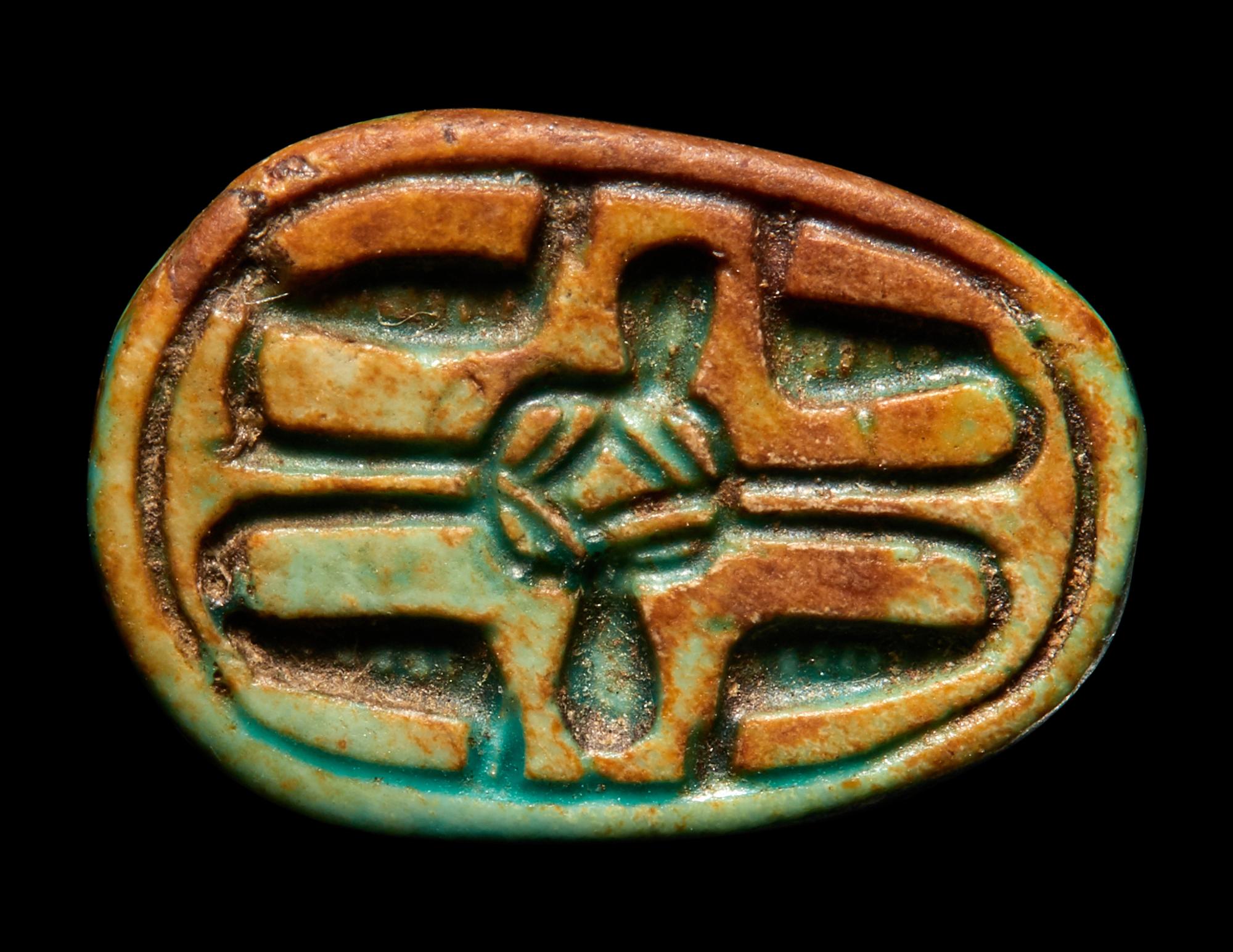 An Egyptian Faience Duck Scaraboid