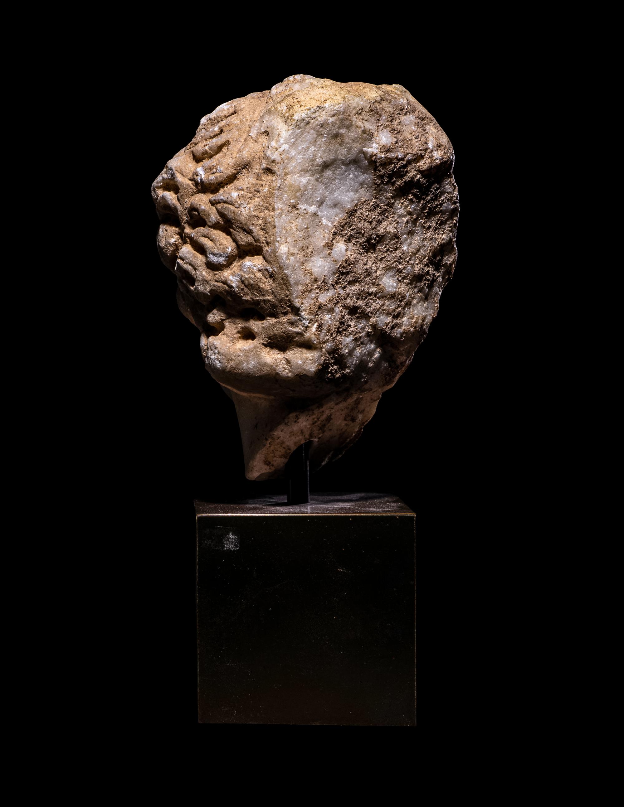 A Roman Marble Portrait Head of a Male Youth