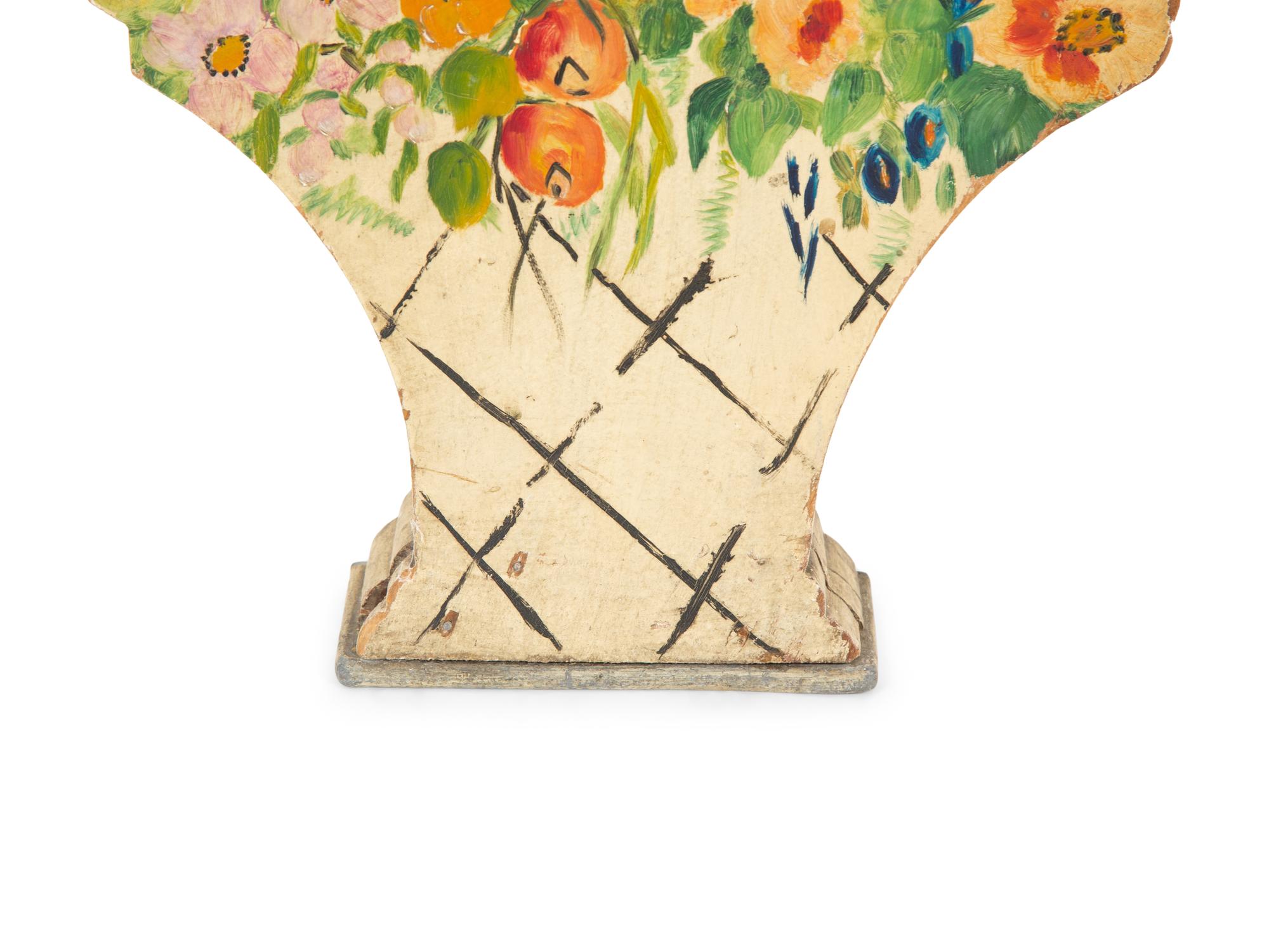 A Victorian Painted Iron Greyhound Doorstop and a Painted Wood Basket Doorstop